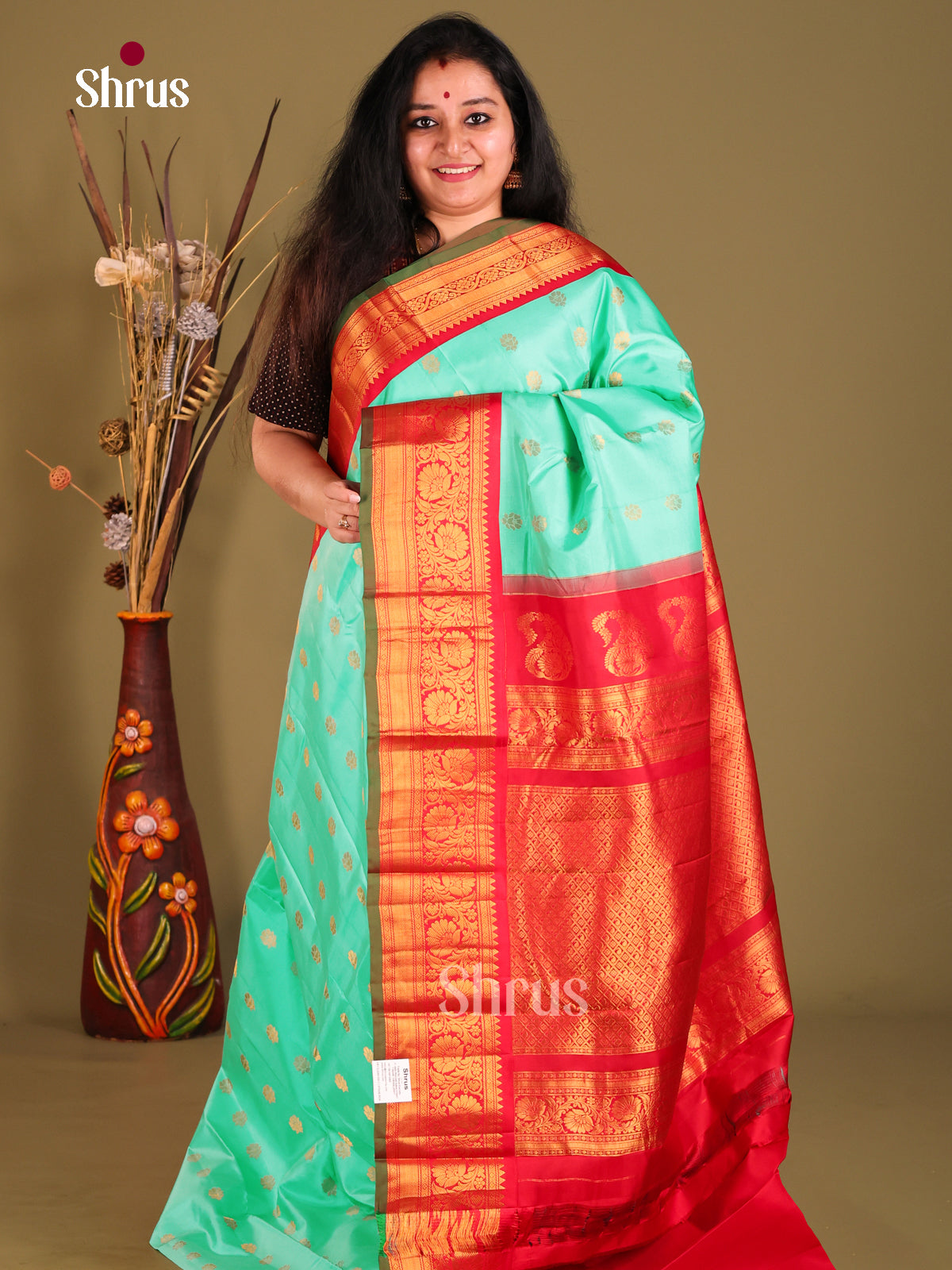 Chic Teal Green Gadwal silk Saree with red zari border with Floral Vines