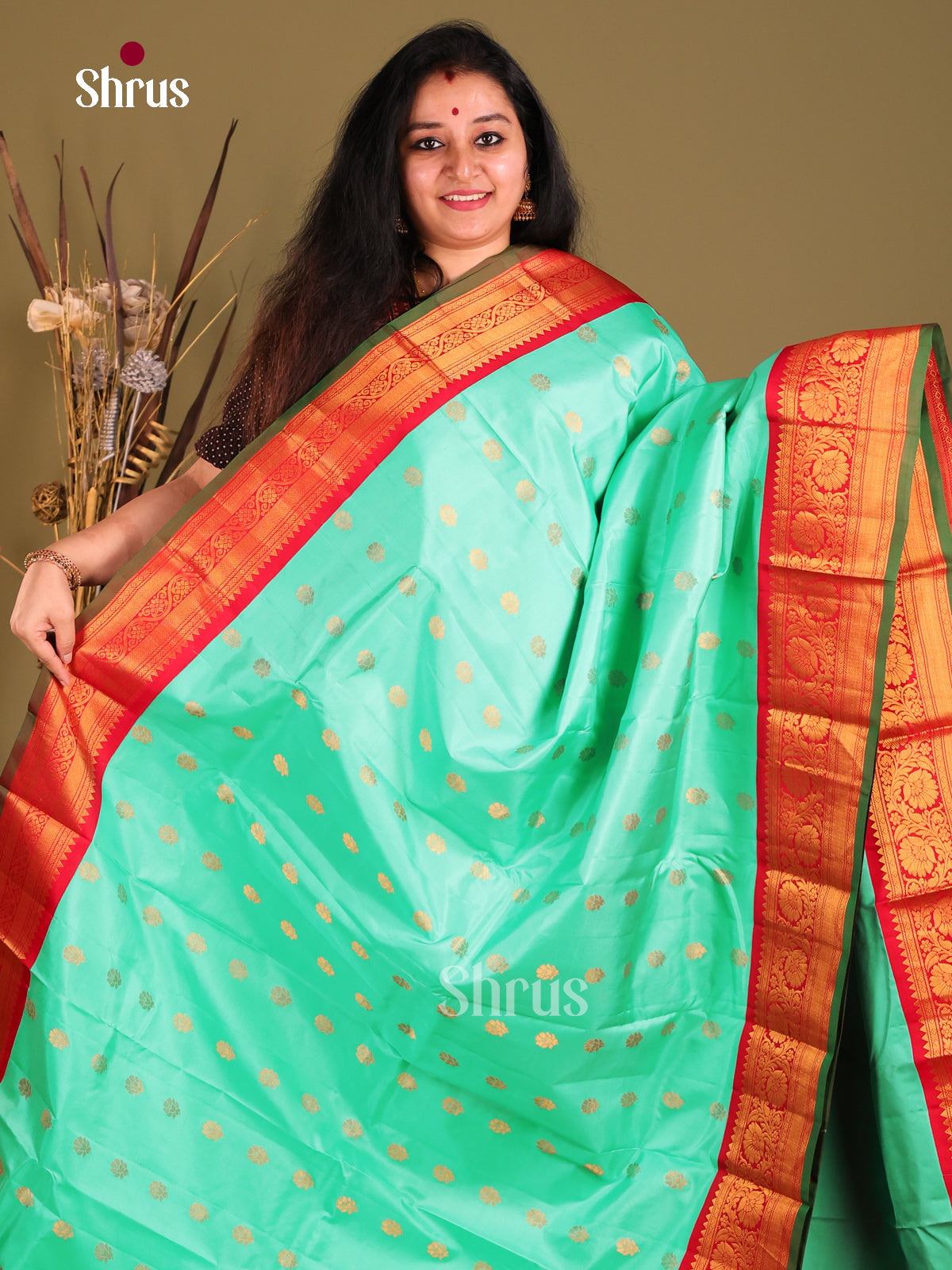 Chic Teal Green Gadwal silk Saree with red zari border with Floral Vines-1