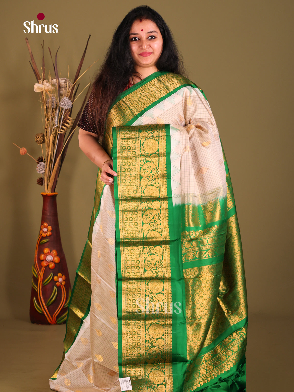 Glistening Cream & Green Gadwal silk Saree with subtle checks & Zari Buttas