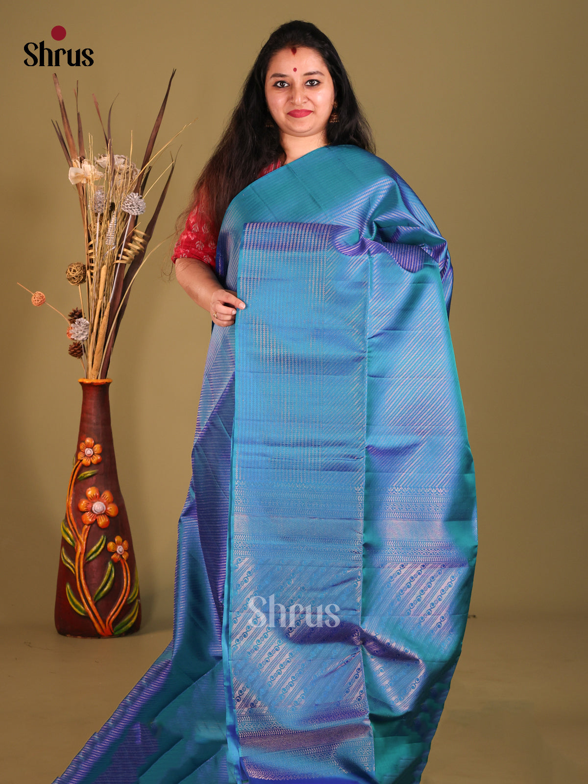 Classy Blue Soft Silk Saree gleams with diagonal zari stripes