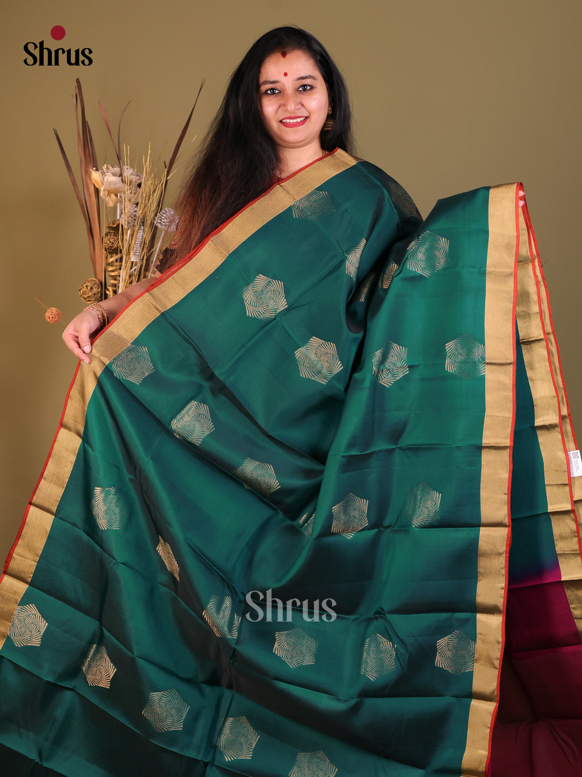 Green & Maroon Softsilk-halfpure Saree gleams with zari motifs