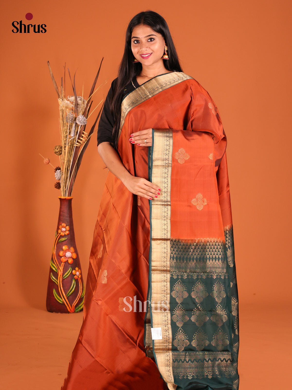 Rust & Green Softsilk-halfpure Saree gleams with gold zari floral buttas