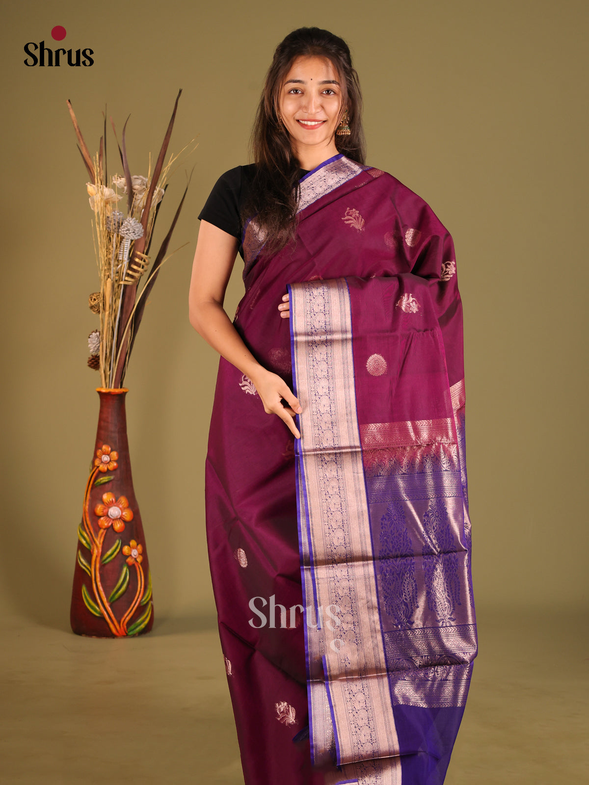 Wine & Blue Silk Cotton Saree gleams with zari floral buttas