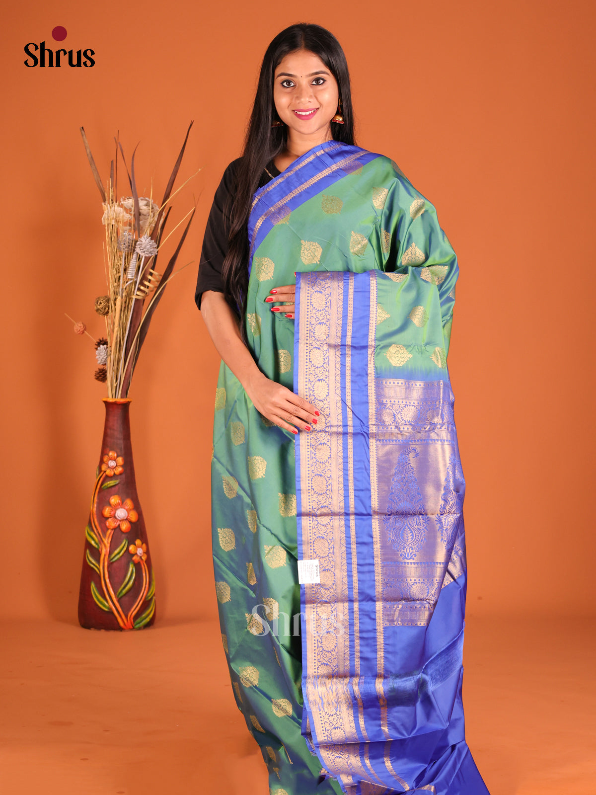 Green & Blue Softsilk-halfpure Saree gleams with gold zari floral motifs - Shop on Shrus.com