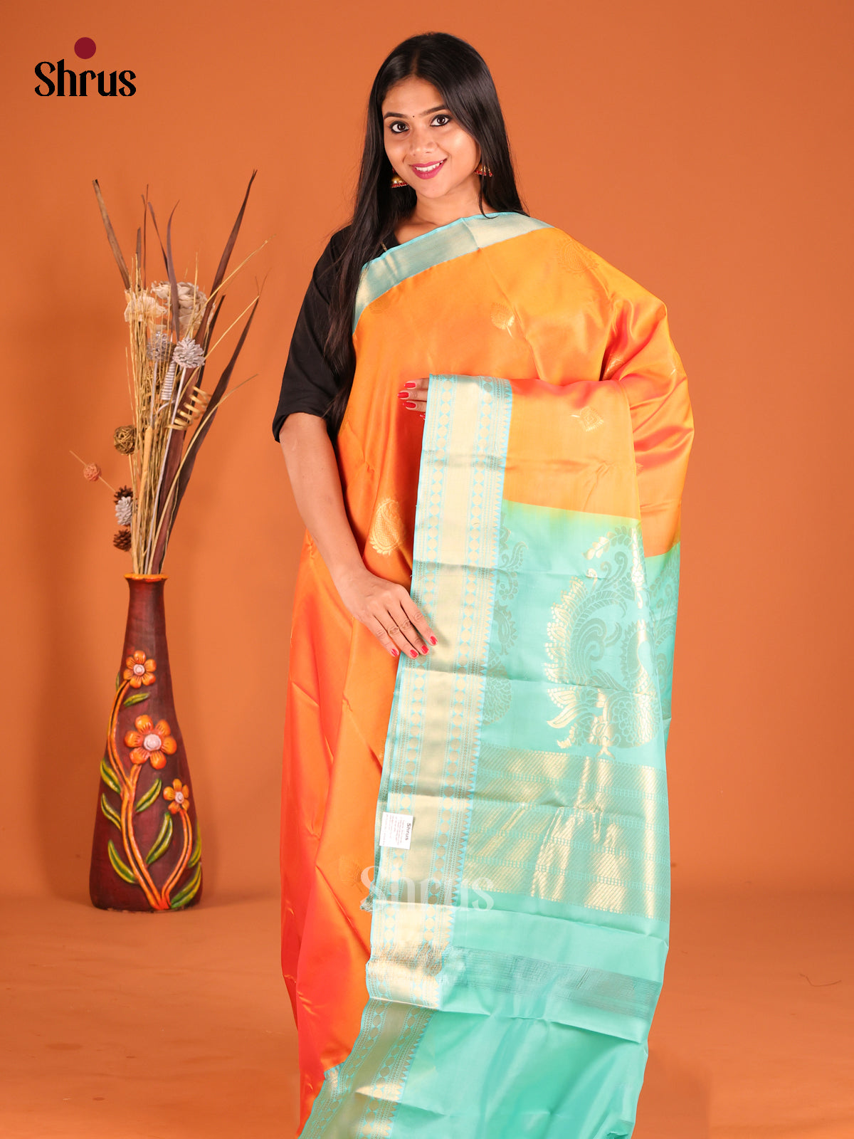 Orange & Teal Softsilk-halfpure Saree with contrast rich zari border