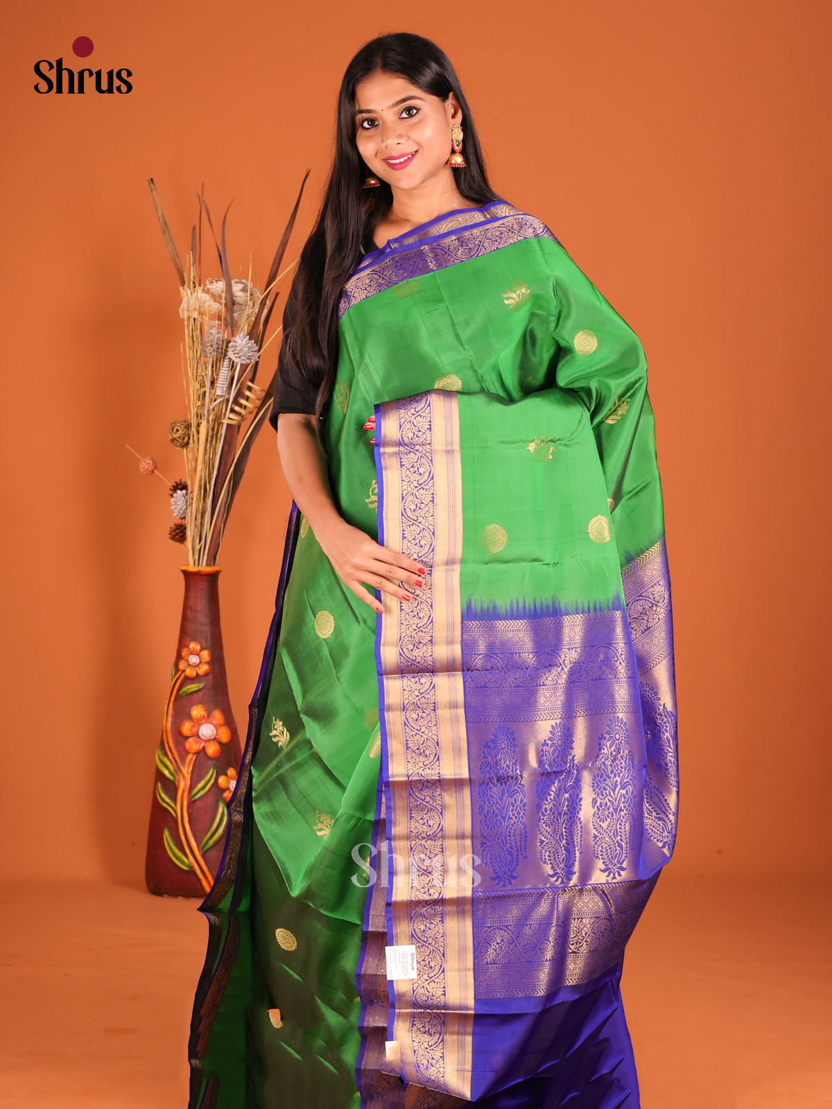 Green & Blue Softsilk-halfpure Saree gleams with zari floral buttas