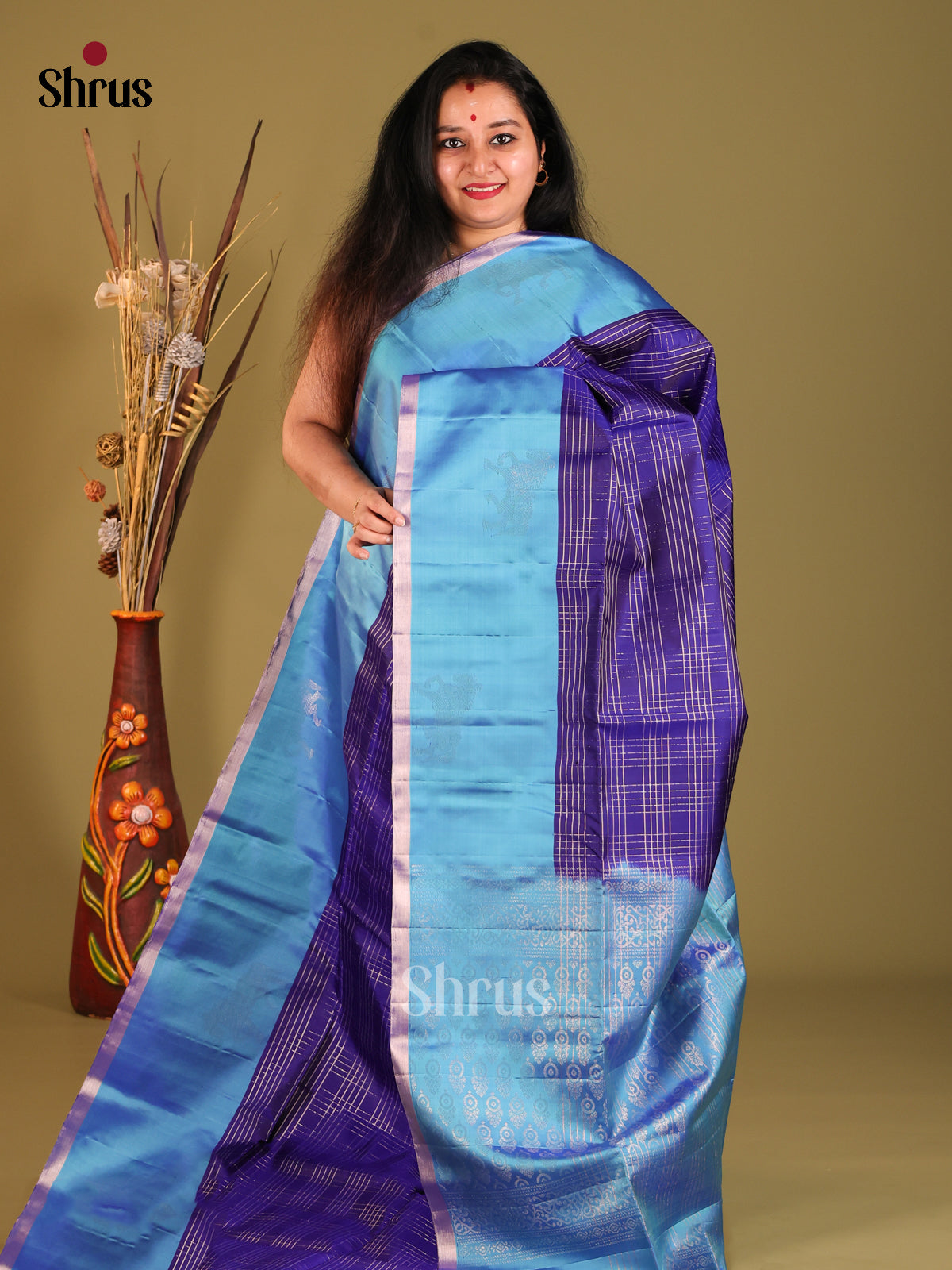 Glistening Navy Blue Soft Silk Saree with Zari checks & Blue Border With horse motifs