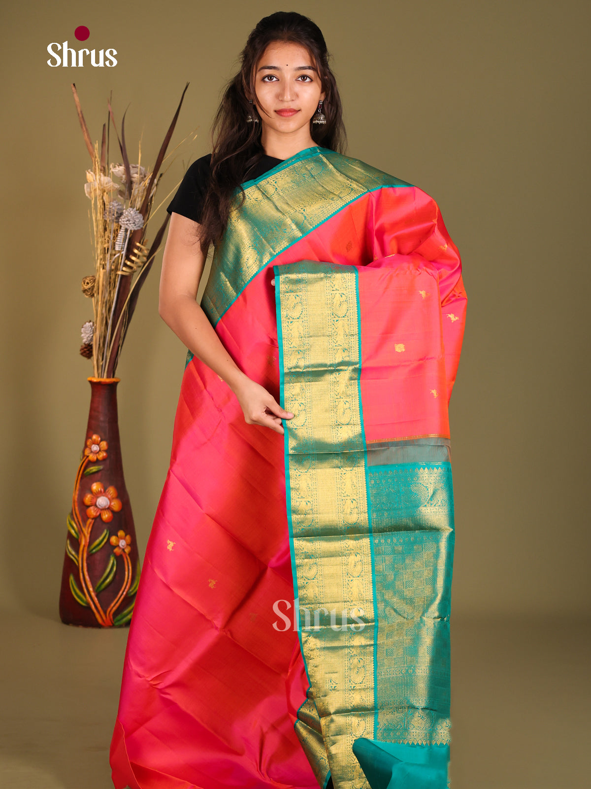 Orangish Pink Korvai Kanchipuram Silk Saree with peacock buttas & Green Brocade Pallu