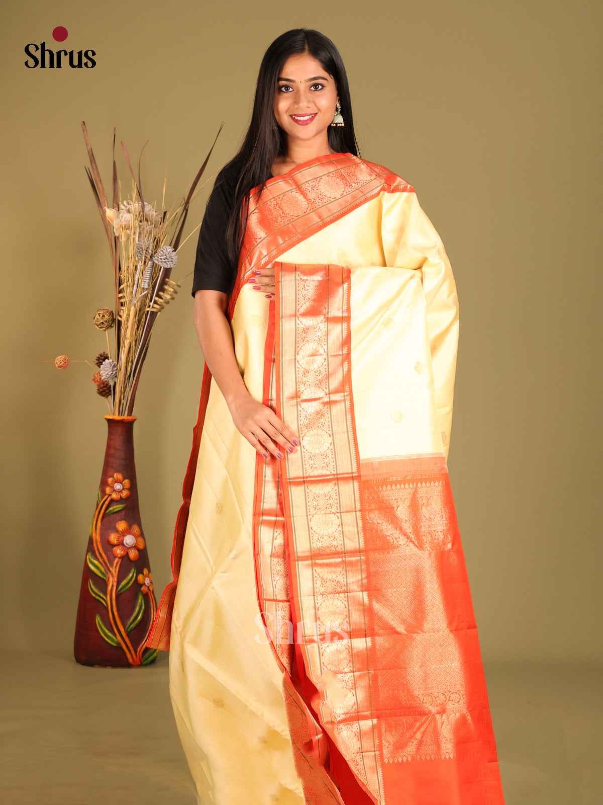 Charming Cream Korvai Kanchipuram Silk Saree with floral buttas & Grand Orange Border
