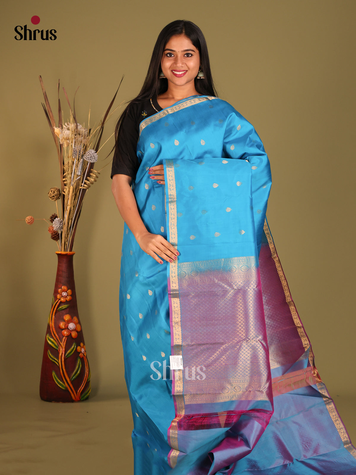 Serene Korvai Blue Kanchipuram Silk Saree with zari floral buttas & Purple Brocade Pallu