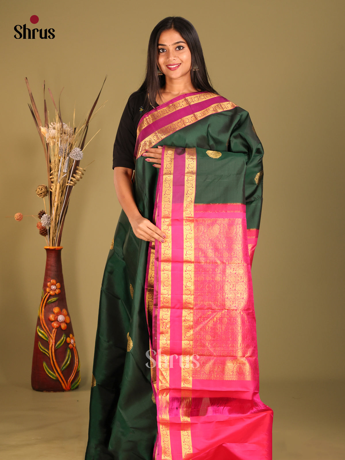 Ethereal Dark Green Kanjivaram Silk Saree with Zari Buttas & Pink Rettaipet border