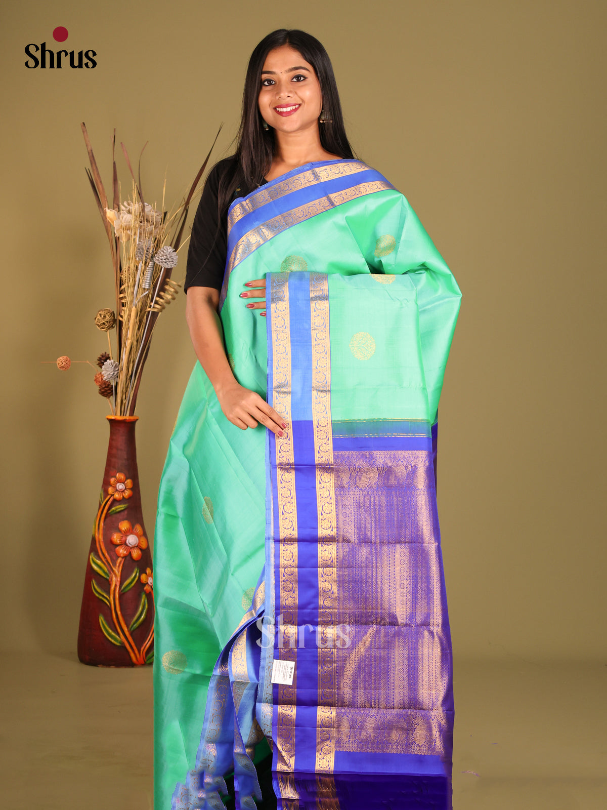 Bright Teal Green Kanchipuram Saree with Golden Floral Motifs & Blue Rettaipet zari border