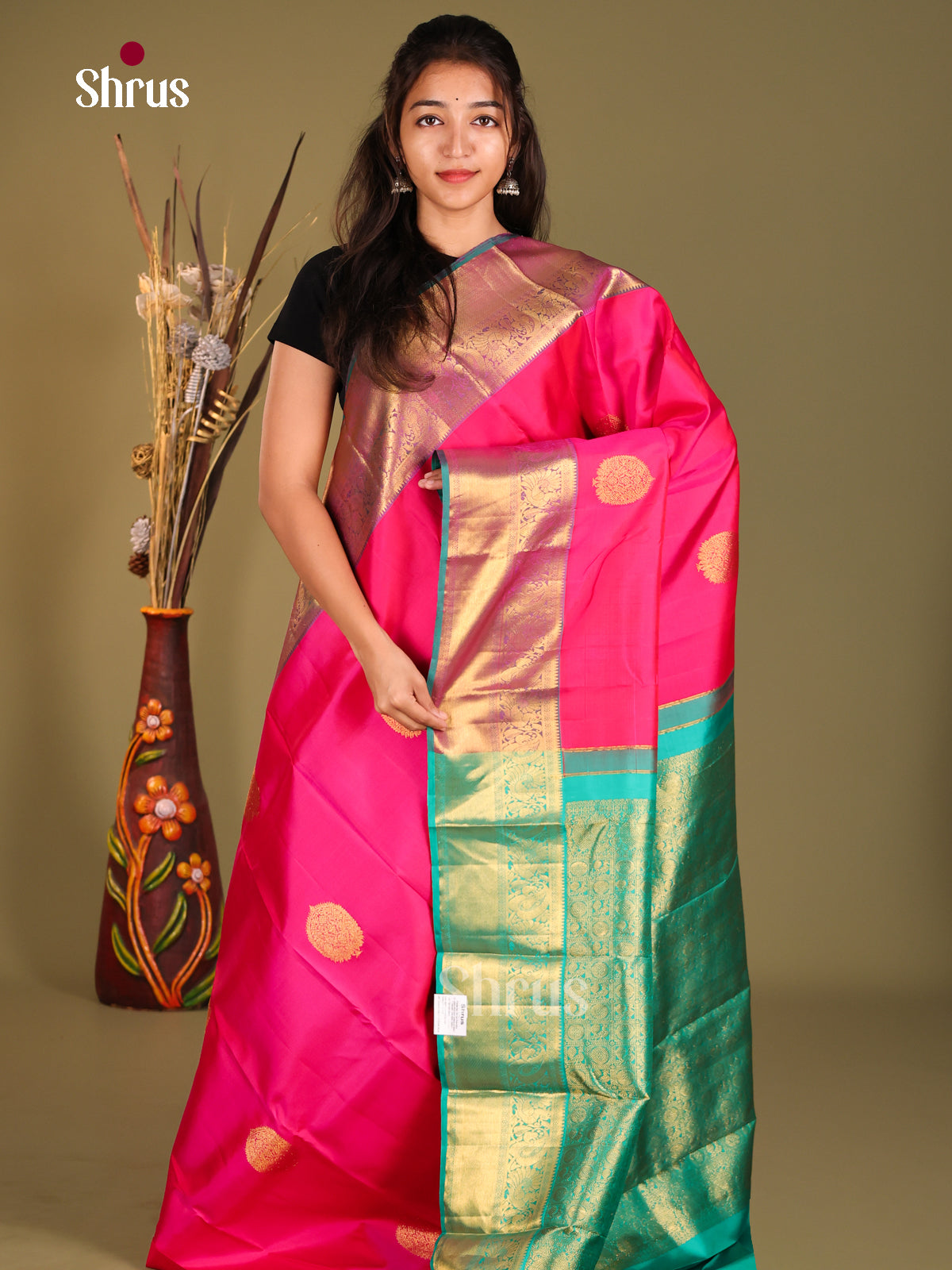 Opulent Deep Pink Kanjivaram Saree with golden floral motifs & Teal Green Pallu