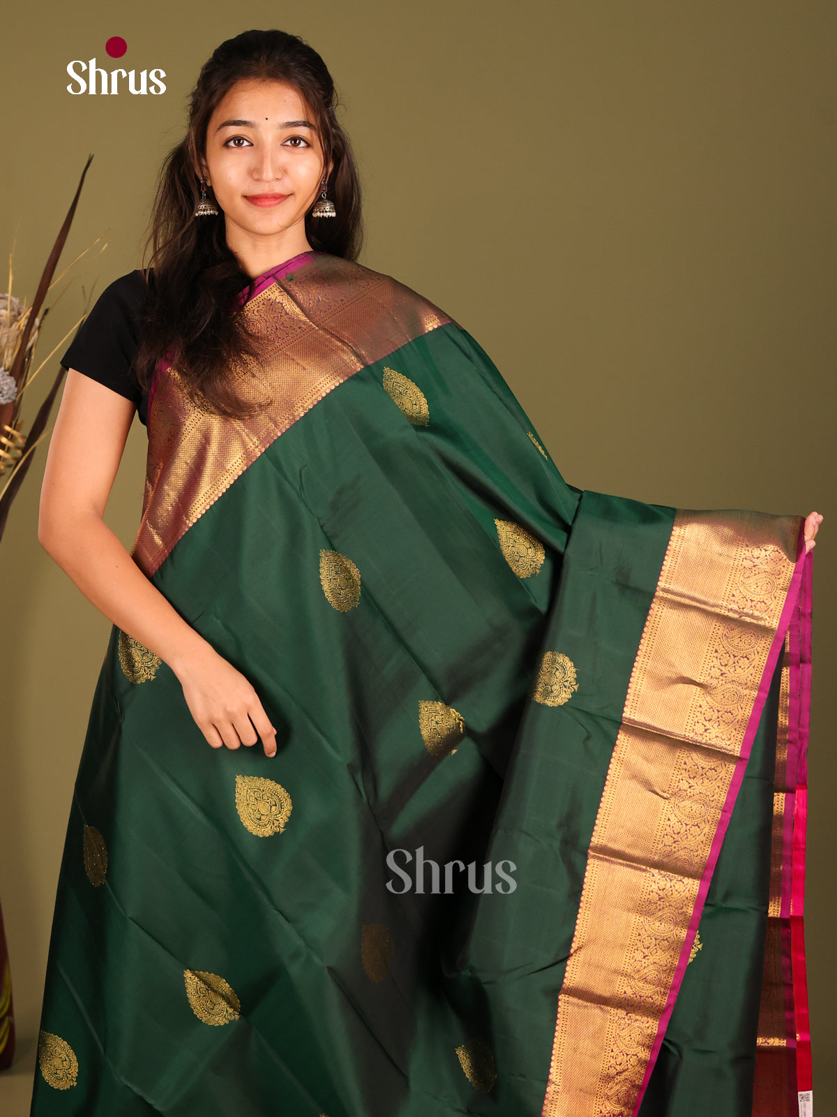 Classy Green Kanchipuram Saree with floral drop motifs & Rich Pink Zari Border -1