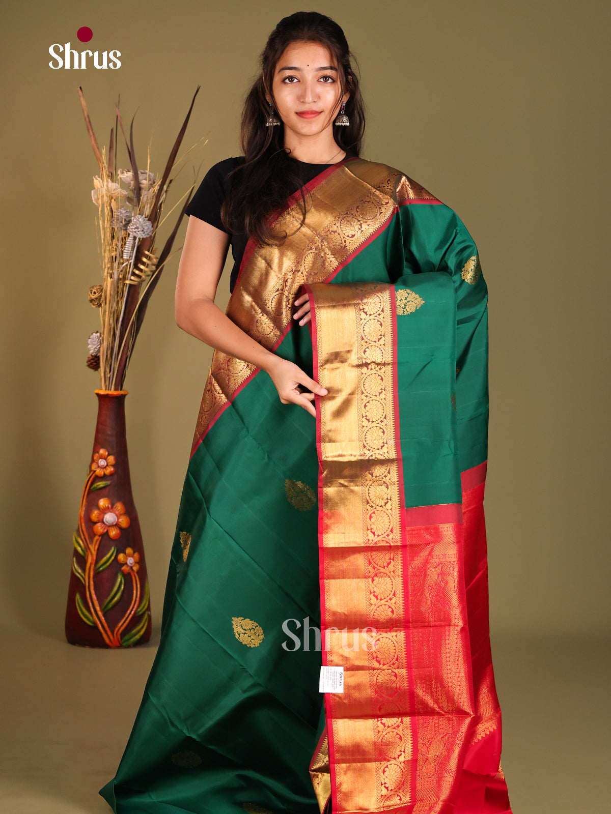 Opulent Green Kanchipuram Silk Saree with Golden thilagam motifs & Red Zari Border