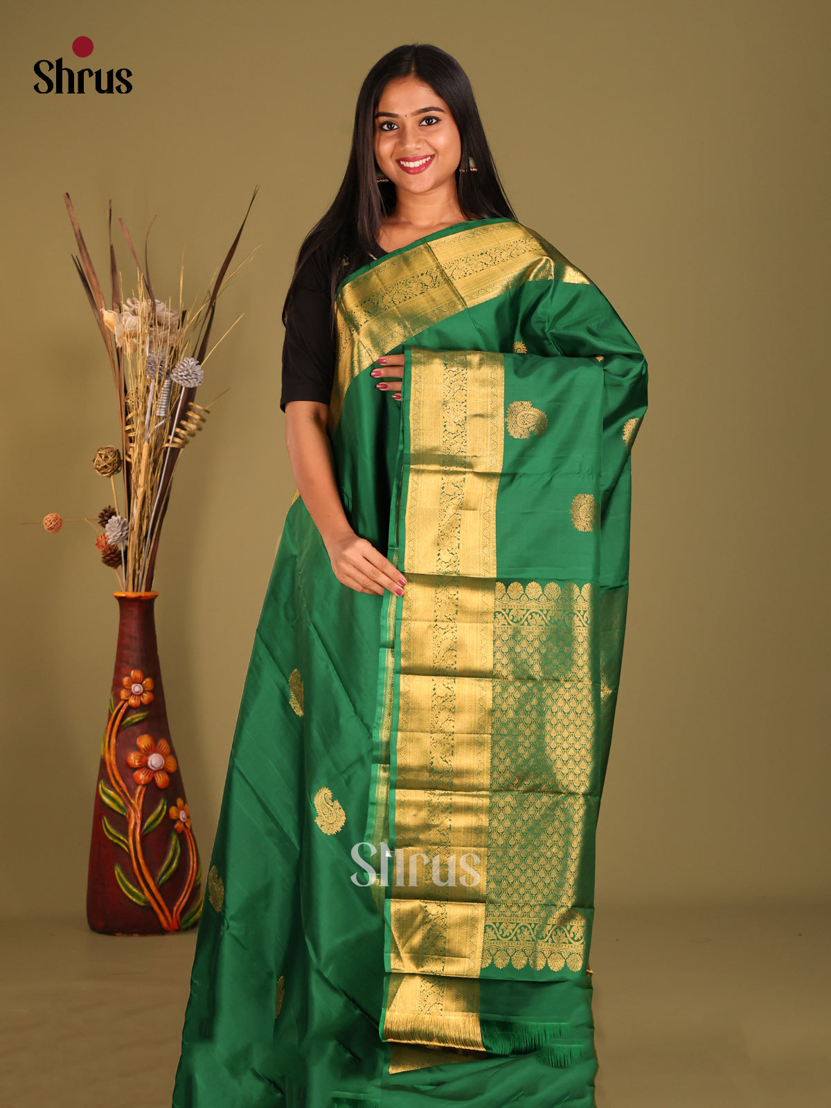 Charming Green Kanchipuram Silk Saree with Gold buttas & Rich Zari Border