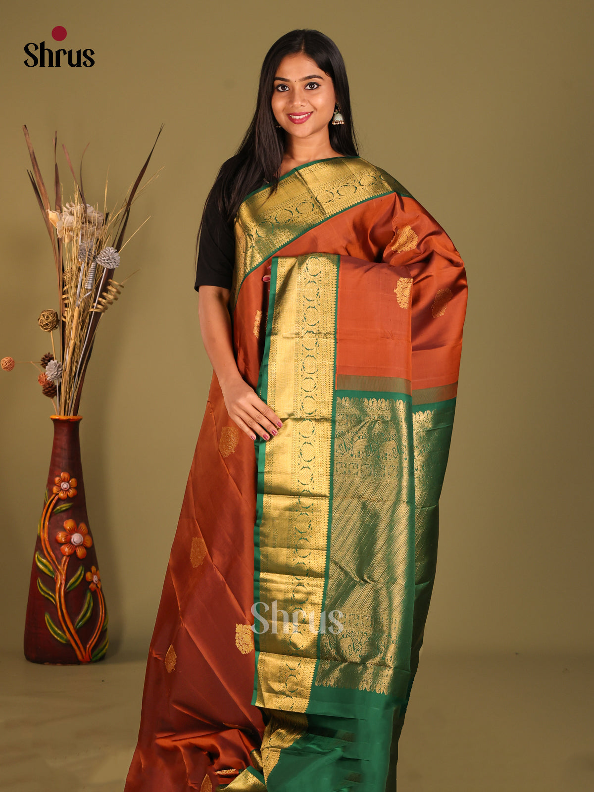 Classy Korvai Rust Kanchipuram Silk Saree with floral buttas & green Brocade Pallu