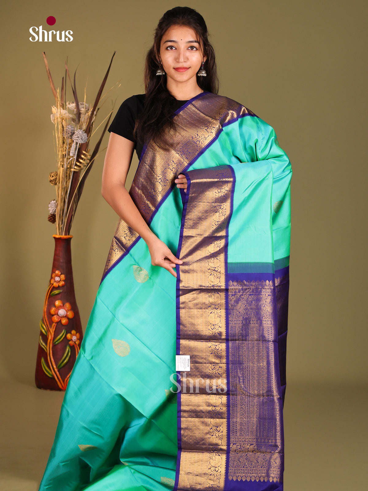 Pastel Blue Kanjivaram Saree with Golden thilagam motifs & Blue Zari Woven Border