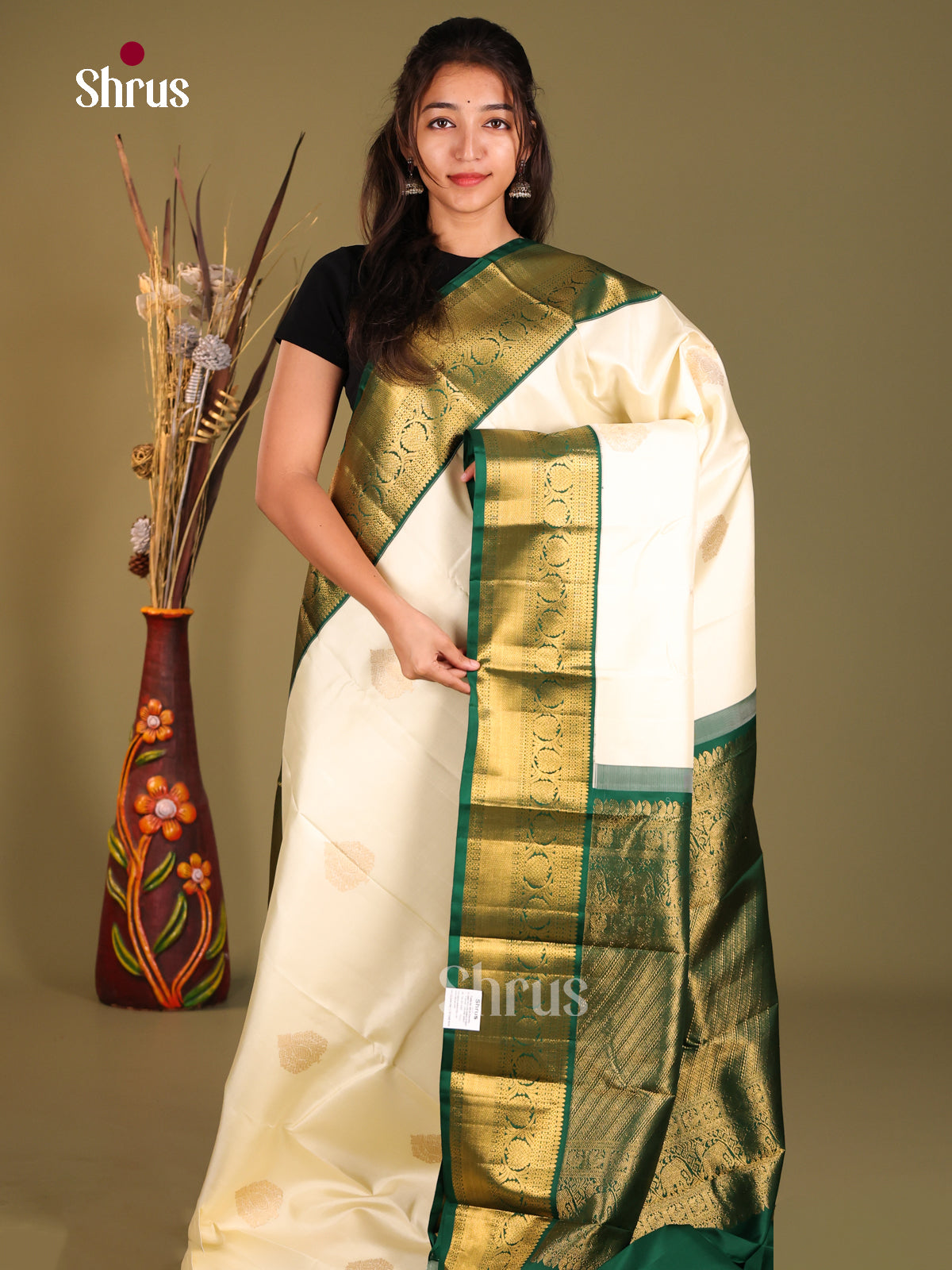 Timeless Cream Kanchipuram Silk Saree with floral drop motifs & Green Brocade Pallu