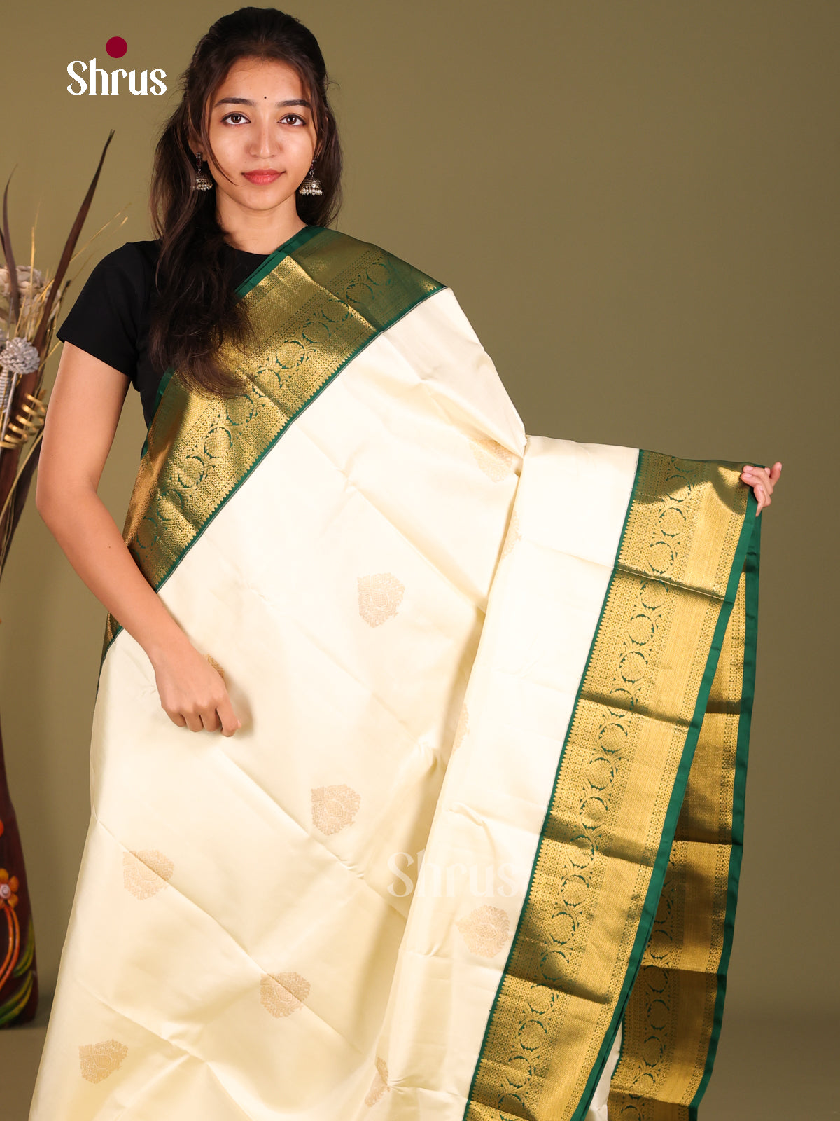 Timeless Cream Kanchipuram Silk Saree with floral drop motifs & Green Brocade Pallu 1