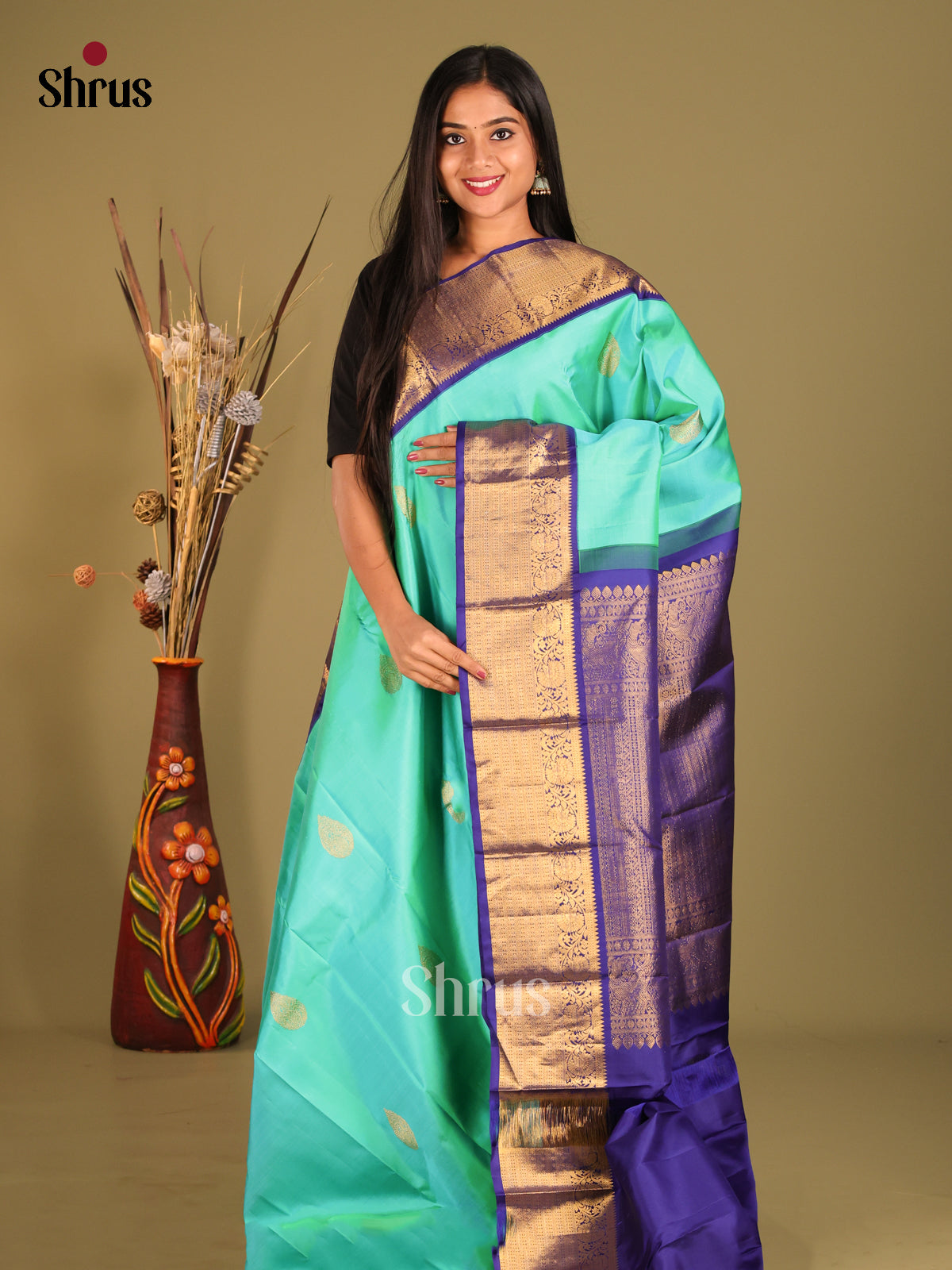 Charming Teal Blue Kanchipuram Silk Saree with thilagam zari motifs & Blue Zari Border