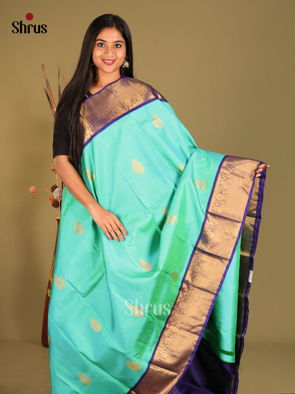 Charming Teal Blue Kanchipuram Silk Saree with thilagam zari motifs & Blue Zari Border 1