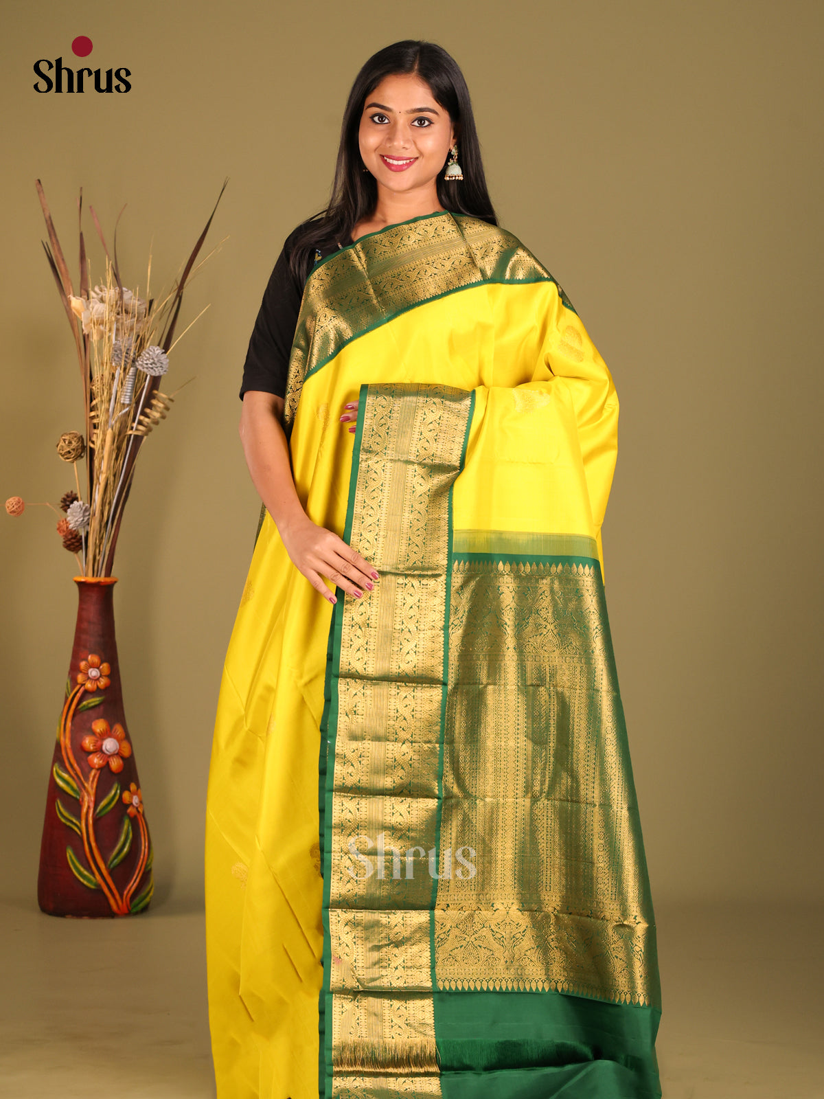 Luminous Yellow Kanchipuram Saree with Paisley Motifs & Green zari border