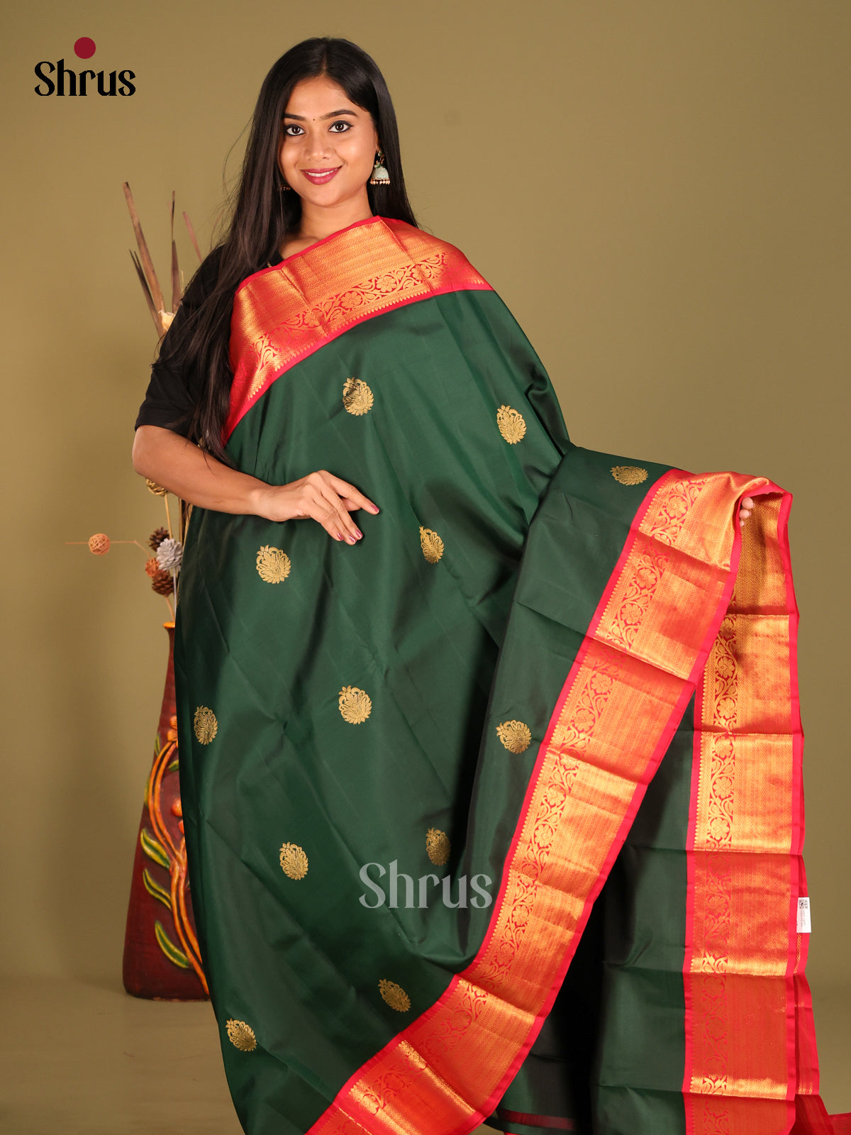 Elegant Green Kanjivaram Silk Saree with floral buttas & Rich Red Zari Border -1