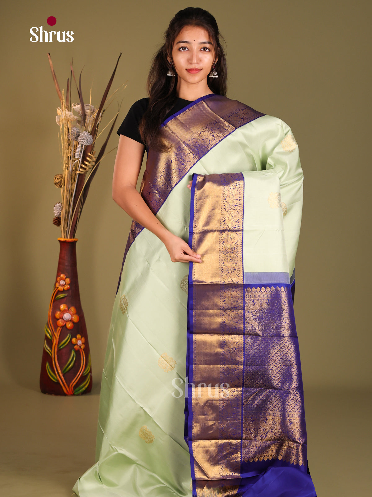 Pista Green & Blue Kanchipuram Korvai Butta Saree gleams with paisleys buttas