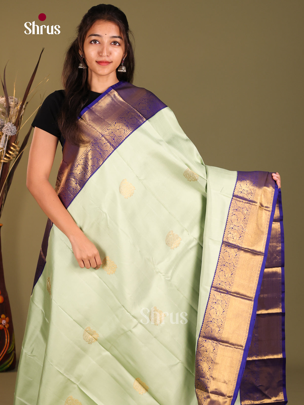 Pista Green & Blue Kanchipuram Korvai Butta Saree gleams with paisleys buttas