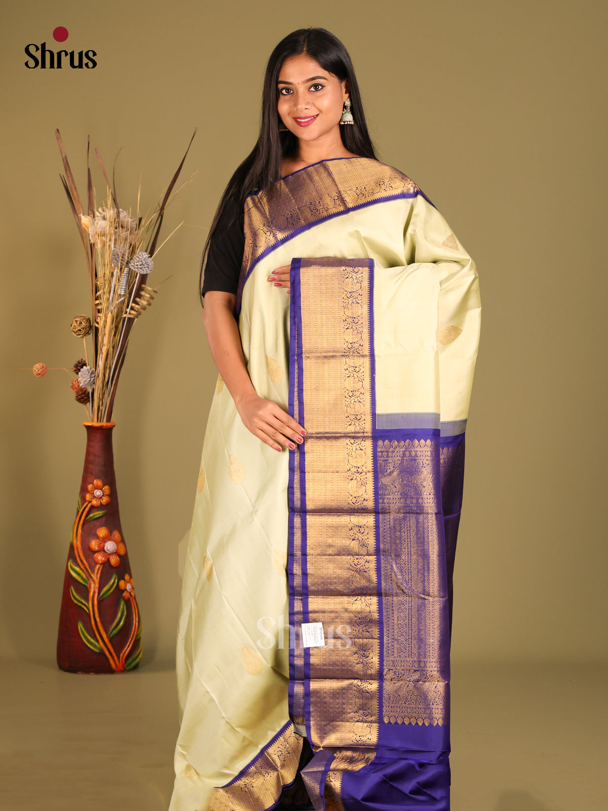 Regal Cream Kanchipuram Silk Saree with golden floral buttas & Blue Brocade Pallu