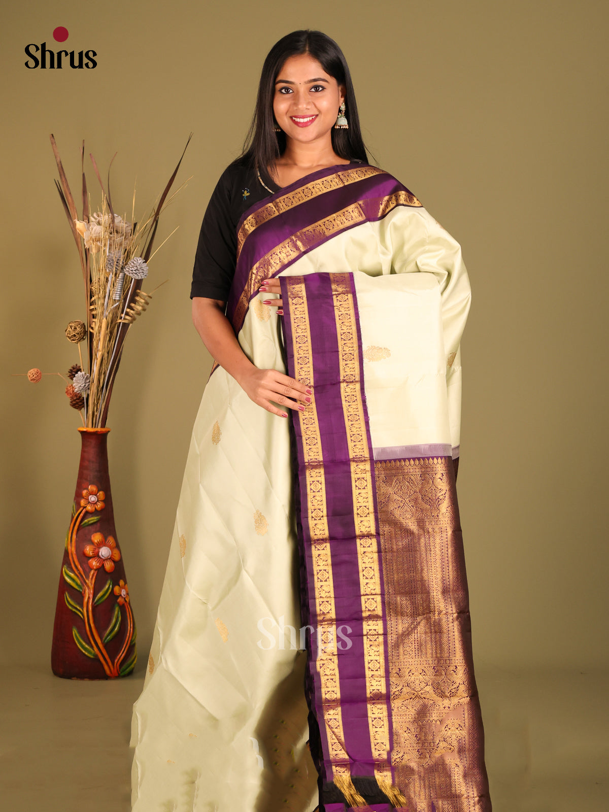 Glistening Cream Kanchipuram Saree with Zari Buttas & Purple Rettaipet zari border