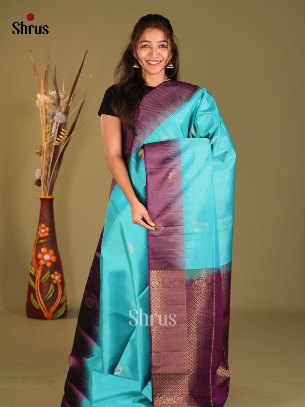 Blue & Violet Soft Silk Saree gleams with zari motifs