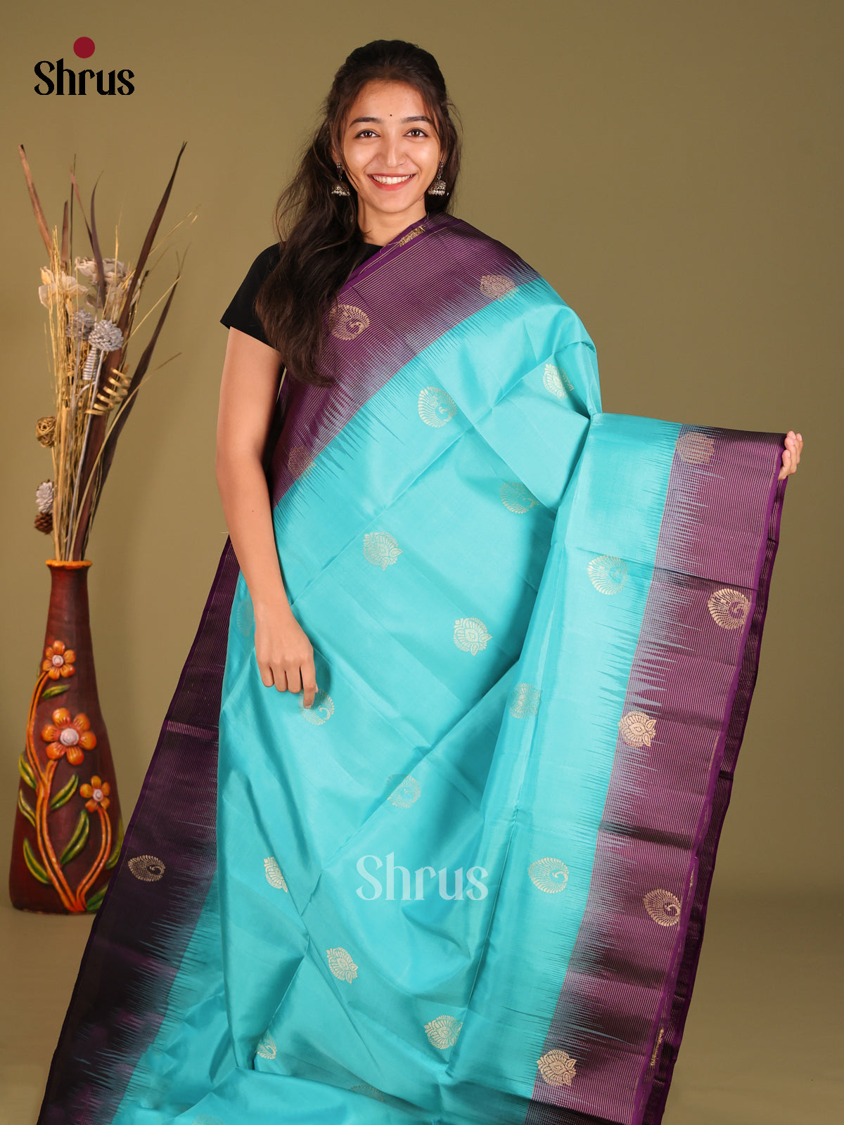 Blue & Violet Soft Silk Saree gleams with zari motifs