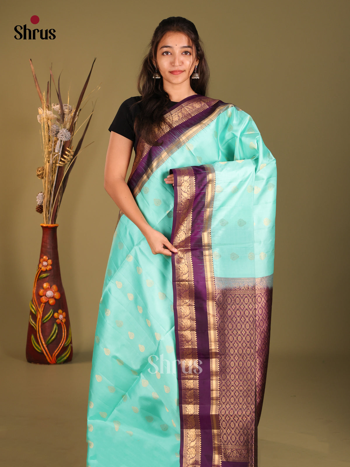 Exclusive Teal Green Soft Silk Saree with zari floral Motifs & Violet Rettapet Zari Border