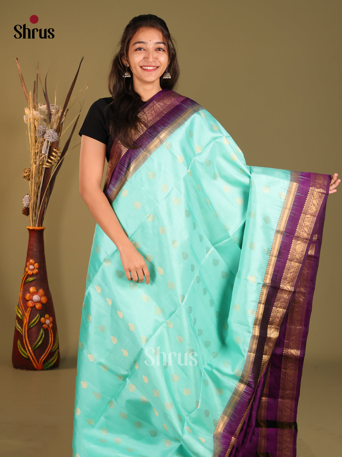 Exclusive Teal Green Soft Silk Saree with zari floral Motifs & Violet Rettapet Zari Border