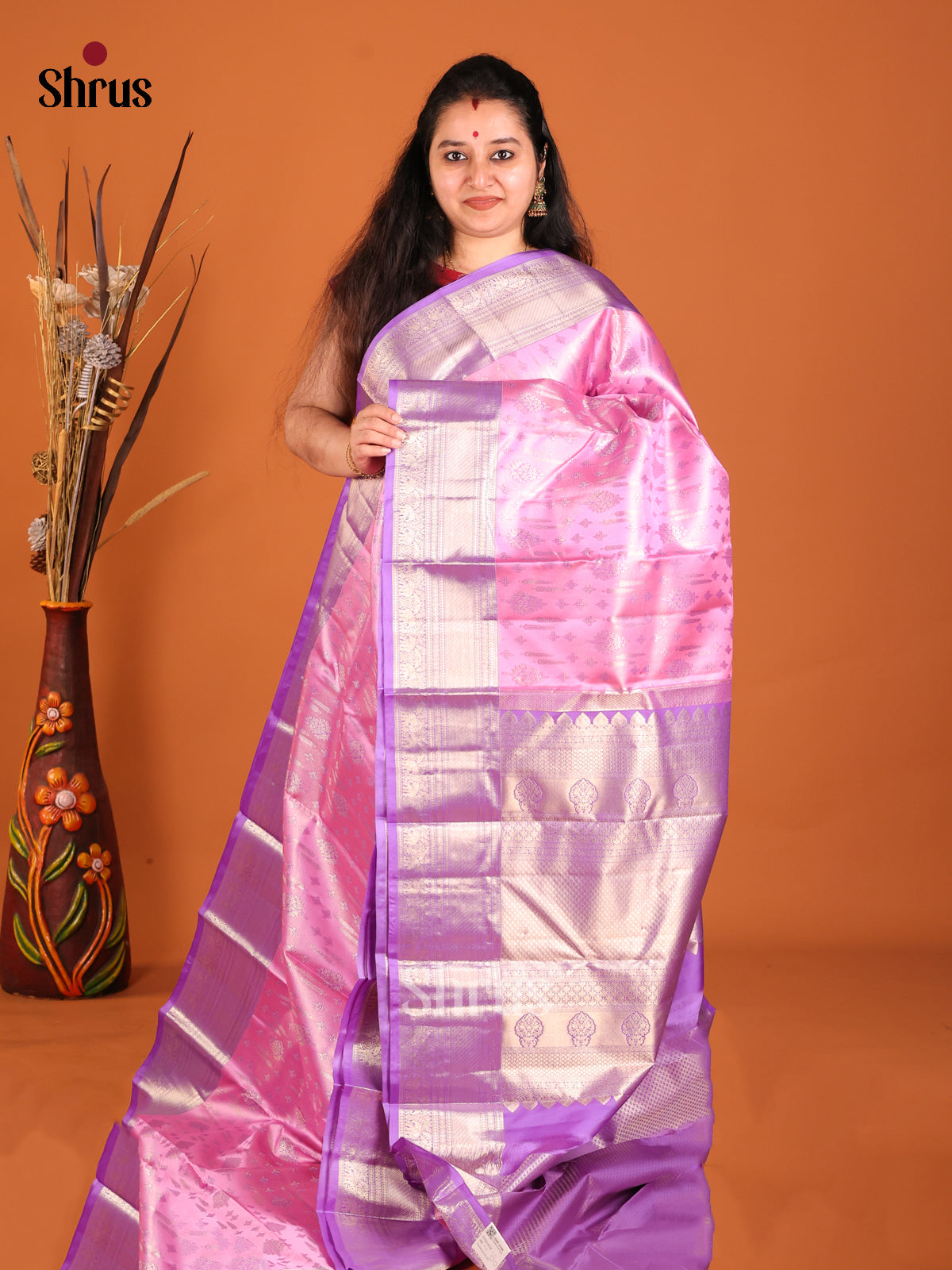 Pink & Purple Kanchipuram silk saree gleams with floral zari brocade