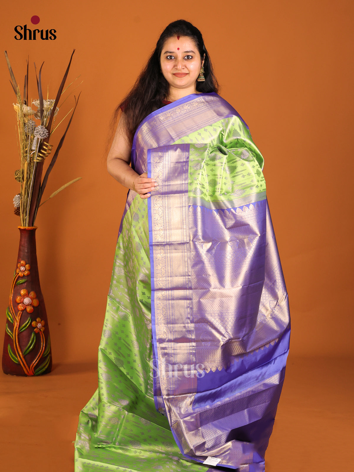 Light Green & Blue Kanchipuram silk saree with rich traditional zari border