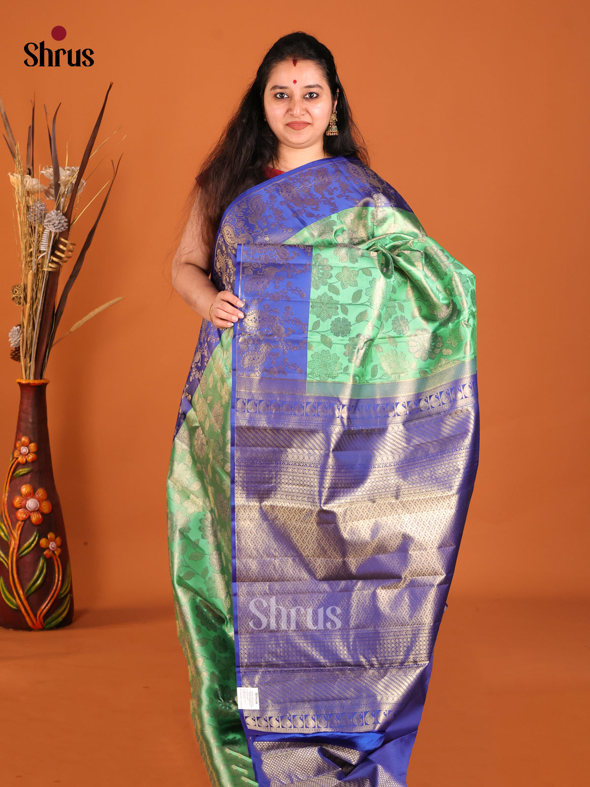 Green & Blue Kanchipuram silk saree with peacock in floral vines zari border - Shop on Shrus.com