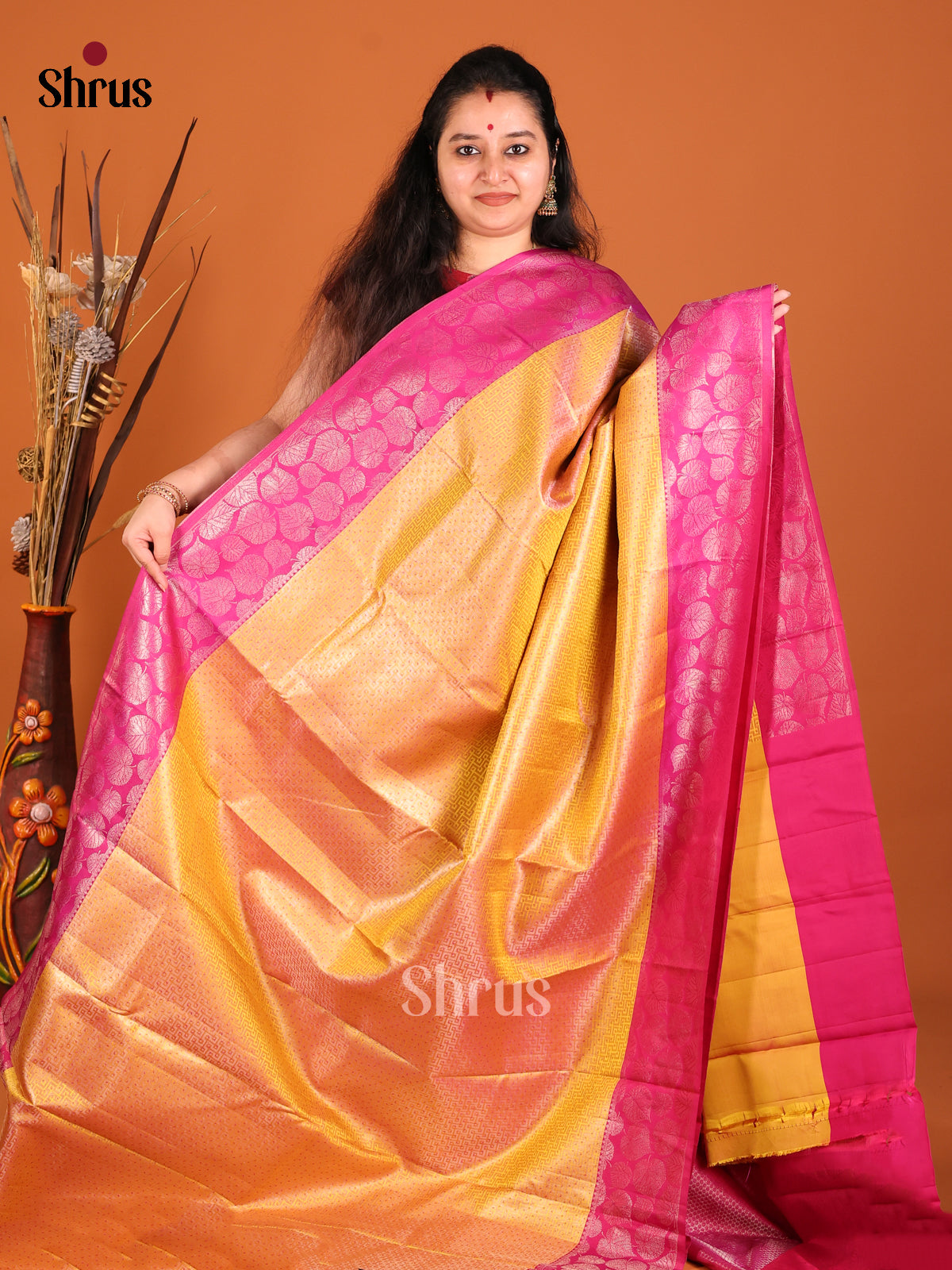 Mustard & Pink Kanchipuram silk saree gleams with leaf buttas in the border -1