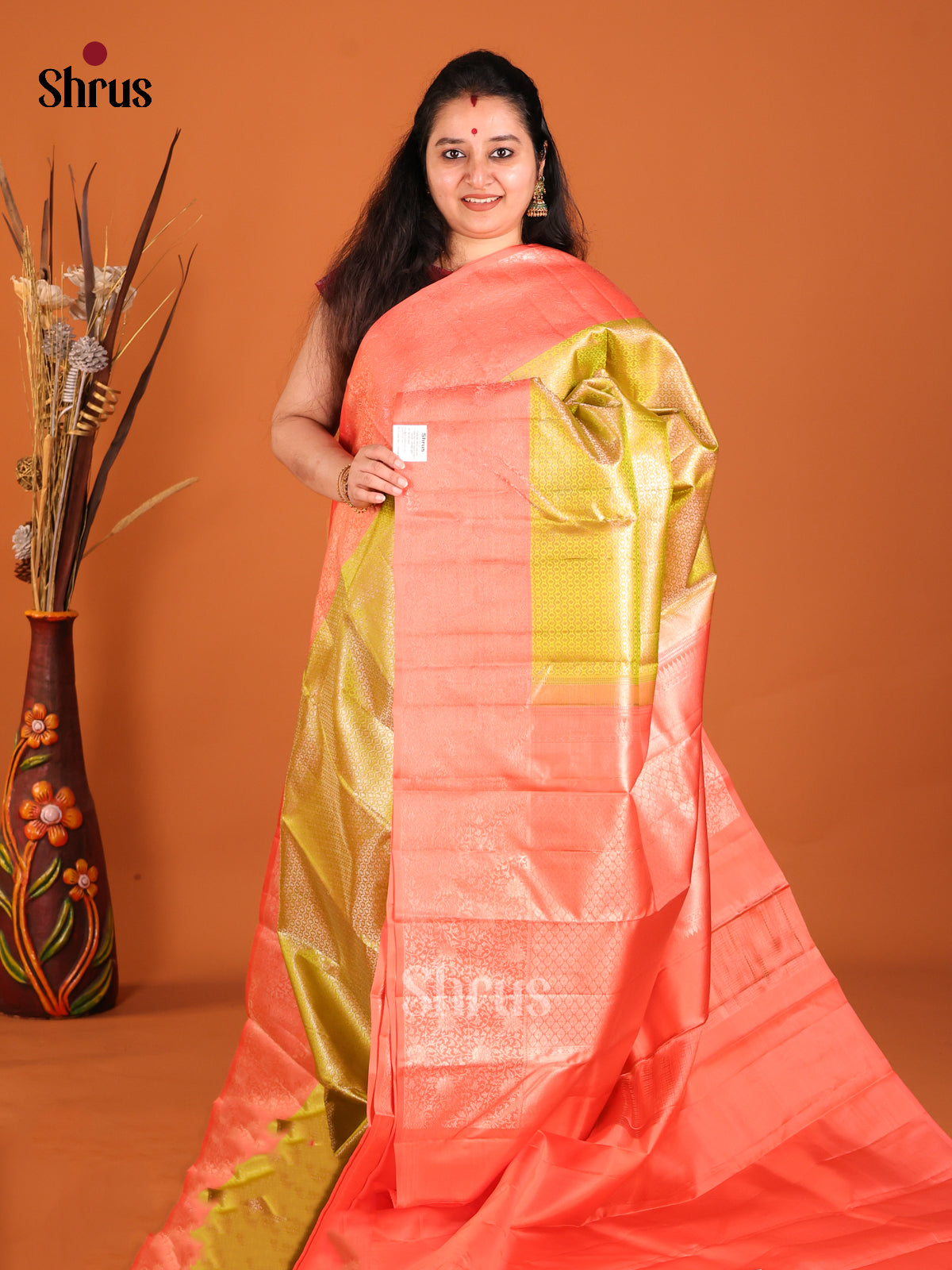Mehandi Green & Orange Kanchipuram silk saree with zari brocade