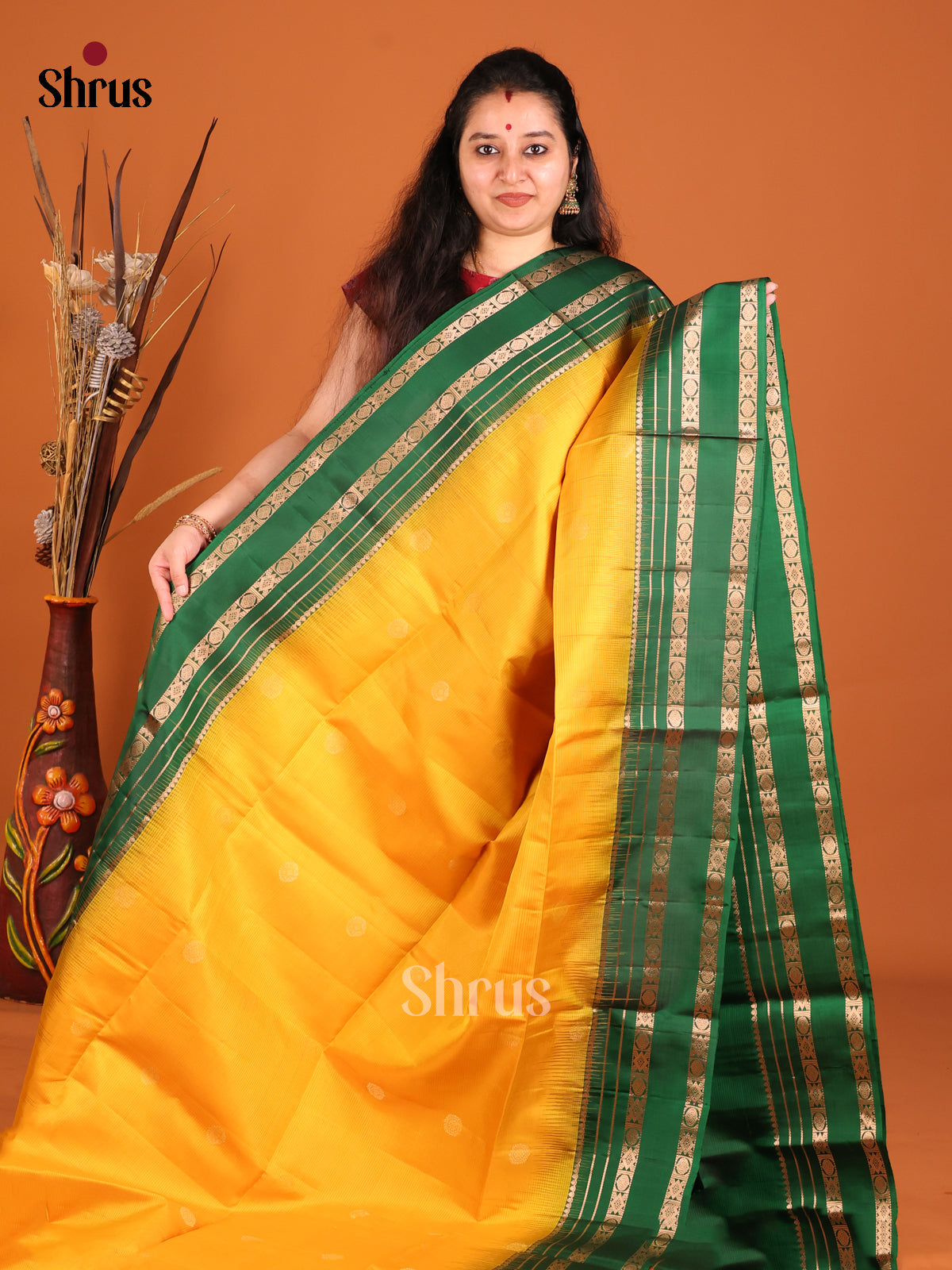 Radiant Yellow Soft Silk saree with Zari Buttas & Green rettaipet border - Shop on Shrus.com