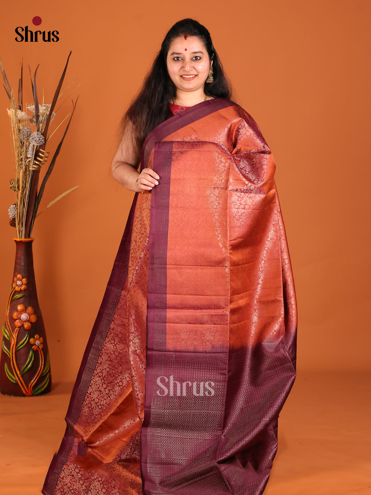 Chic Rust Orange Soft Silk Saree with zari floral nestling brocade & Maroon Border