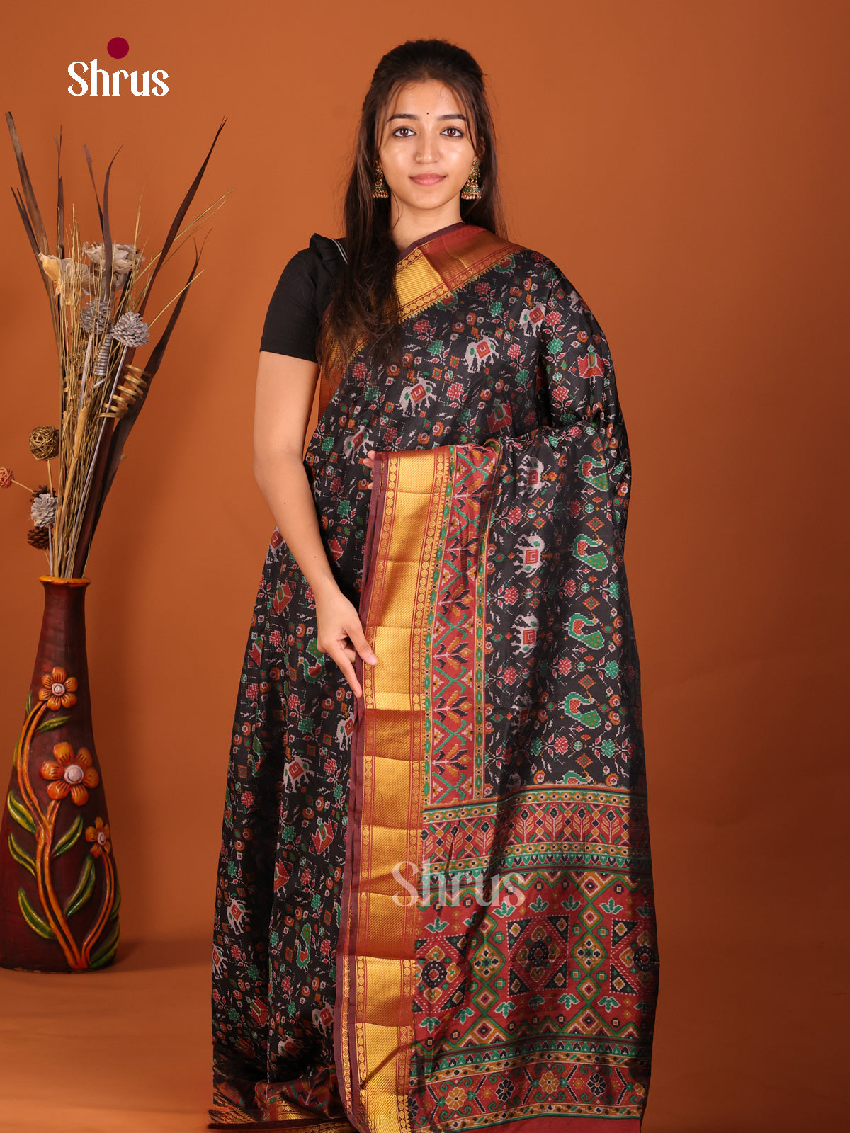 black with red zari semi patola saree