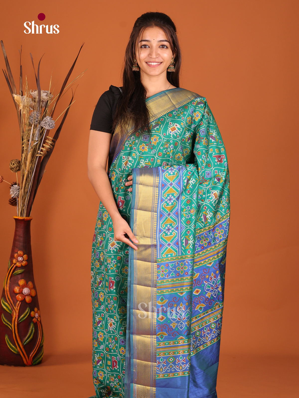 teal green with blue semi patola saree