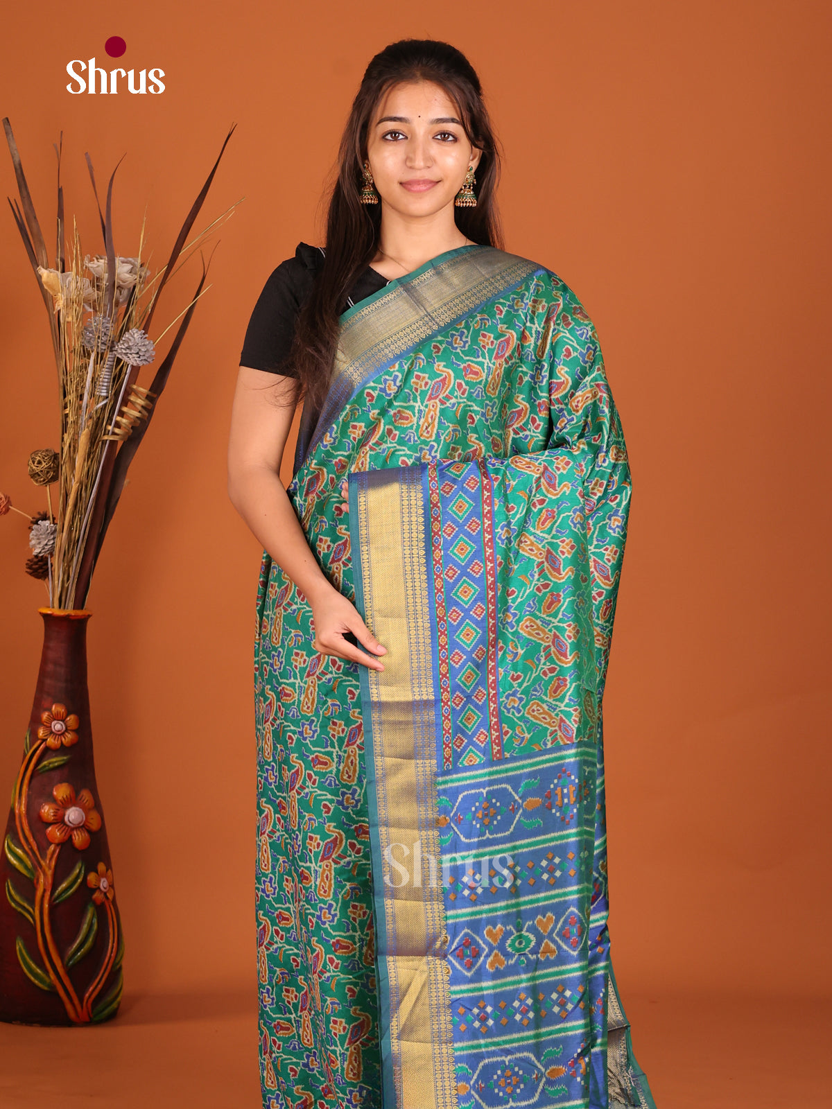 teal with multi color semi patola saree