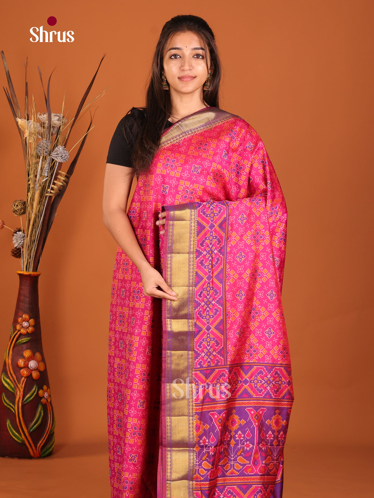 pink and purple designed semi patola saree