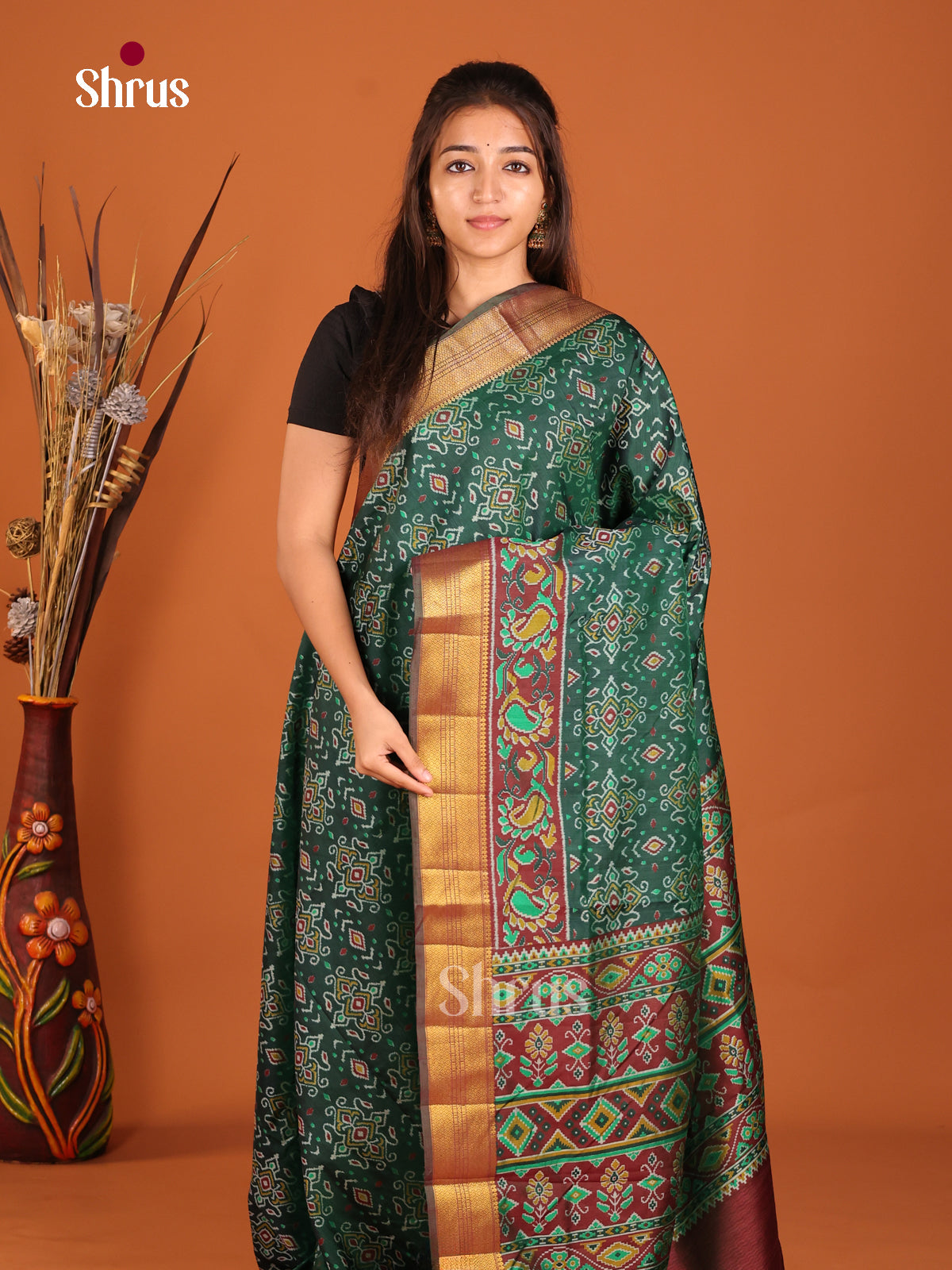 green and brown semi patola saree