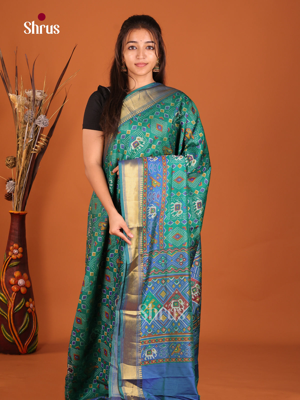 Teal green and blue semi patola saree