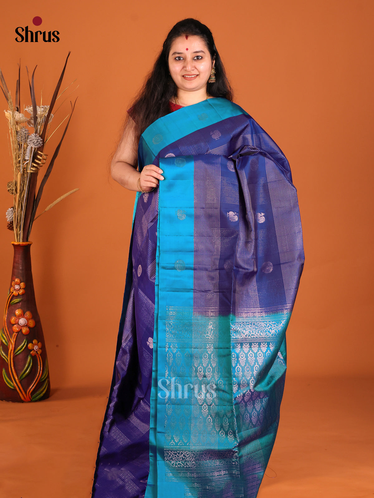 Classic Blue Soft Silk Saree with zari checks, peacock buttas & Teal Border